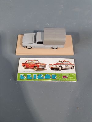 a toy car and a card on a table