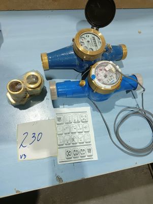 three different types of water meters on a blue table