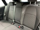 the back seats of a car with black seats and gray seats
