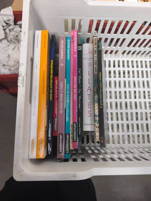 a basket full of books sitting on a table