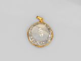 un pendentif en or et diamants représentant le portrait d'un homme