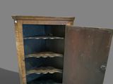 a small cabinet with a door open on a gray background