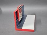 a red book with a picture on it sitting on a table