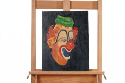a painting of a clown with a green hat on a easel