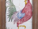 a picture of a tile with a rooster on it