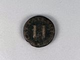un gros plan d'une pièce de monnaie sur laquelle figure la lettre « u »