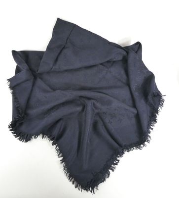 an image of a black scarf with fringes on it