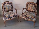 two chairs that are sitting next to each other on the floor