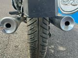 a motorcycle that is parked on the side of the road