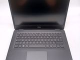 the dell laptop is open and ready to be used