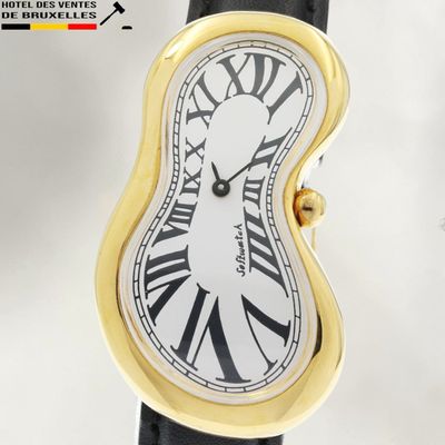 a close up of a wrist watch with roman numerals on the face