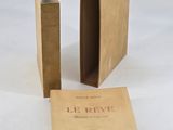 two books sitting next to each other on a white surface