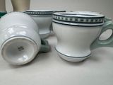 three cups sitting next to each other on a table