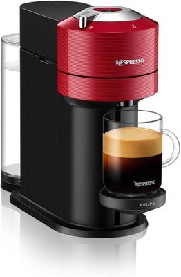 une machine à café rouge avec une tasse de café à côté