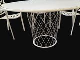 an image of a white table with four chairs around it
