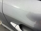 a close up of a car ' s door handle and door handle