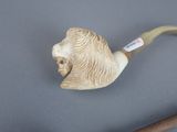 a picture of a pipe with a lion head on it