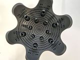 a close up of a black object on a white surface