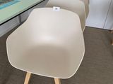 four chairs sitting in front of a table with a book on it