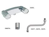 a close up of a faucet with two handles and a hose