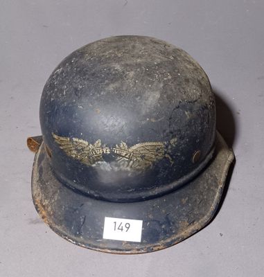 a helmet that has a gold eagle on it