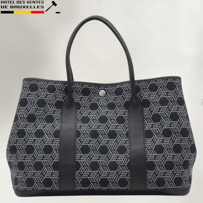 a black and white tote bag with a geometric pattern
