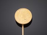 an image of a gold coin lollipopper on a black background