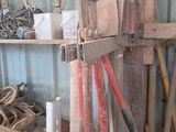 a pile of tools that are sitting on a shelf