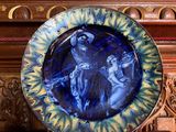 a blue plate with a picture of a man and a woman on it