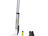 a white and black vacuum cleaner with a yellow stick
