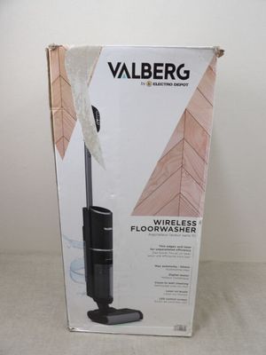 un carton contenant un aspirateur posé sur une table