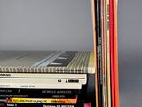 several books stacked on top of each other on a table