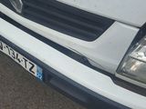 a picture of a white van parked in a parking lot