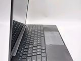 a black laptop with a silver keyboard on a white surface