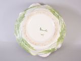 a white plate with a green and white design on it