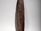 a cigar shaped object on a white surface