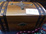 a wooden box with a sign on it sitting on a table