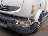a white truck that is parked in a parking lot