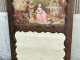 une image représentant un miroir orné d'une peinture, posé par terre