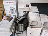 many boxes of kitchen appliances sitting on a table