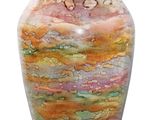a glass vase with a multicolored design on it