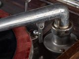 a close up of a metal pipe on a record player