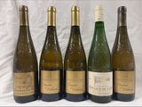 six bottles of wine are lined up in a row on a table