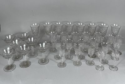 a lot of wine glasses sitting on a table