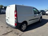 a white van that is parked in a parking lot
