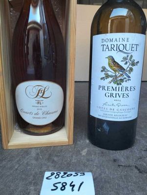 two bottles of wine sitting next to each other on a table