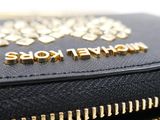 a close up of a black purse with a gold zipper