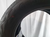 a close up of a tire on a table with a piece of paper