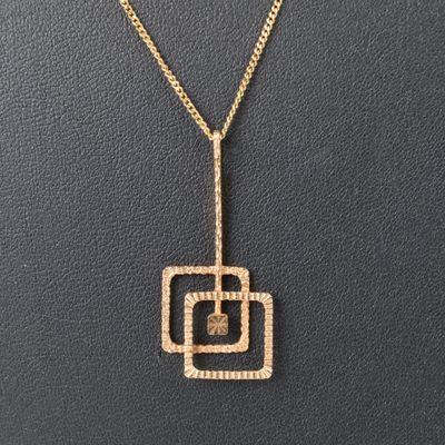 Pendentif géométrique en or années 1960-70. 38 mm. - Photo 1