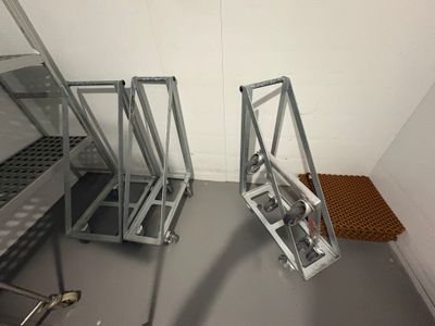 two ladders that are sitting in the corner of a room